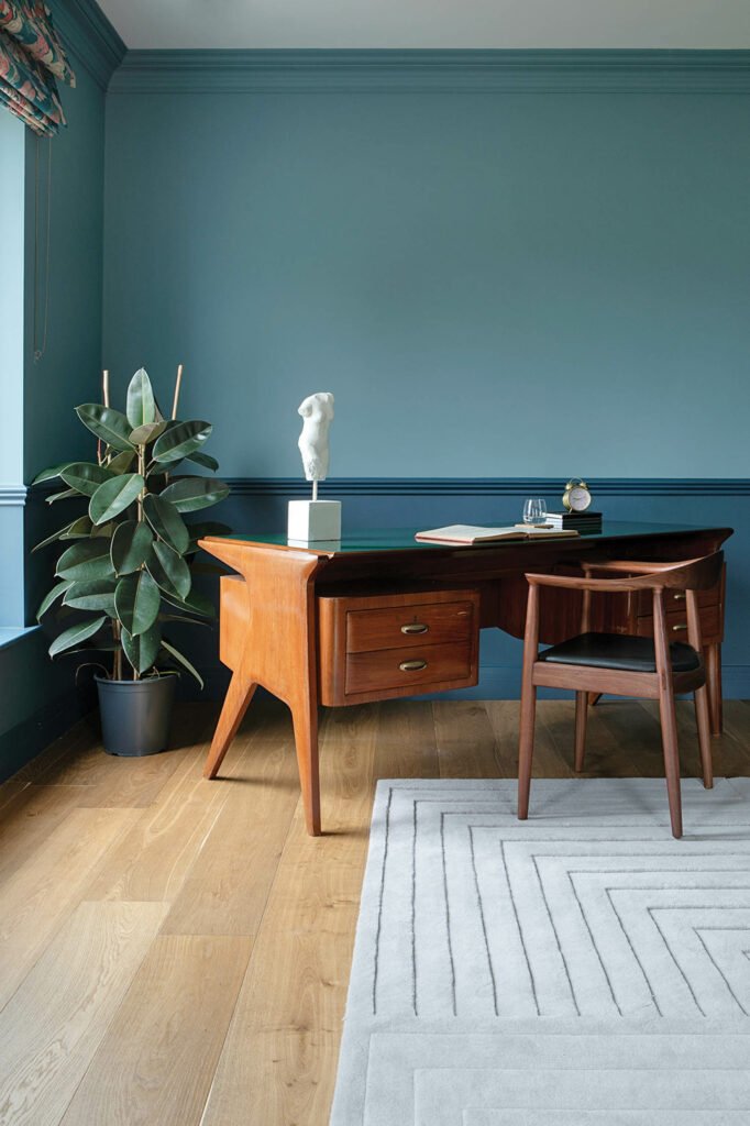 A vintage desk appoints the adjacent study.