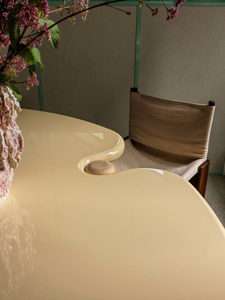 A curved conference table with a small indent