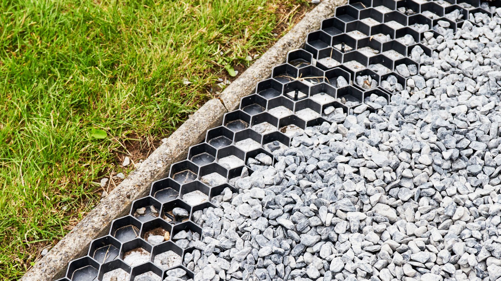 Edgeof gravel driveway showing gravel grids