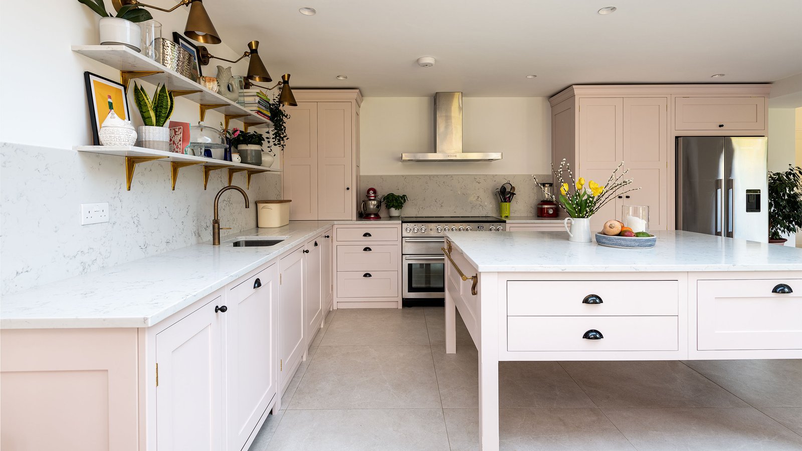 pale pink kitchen with large kitchen island on legs