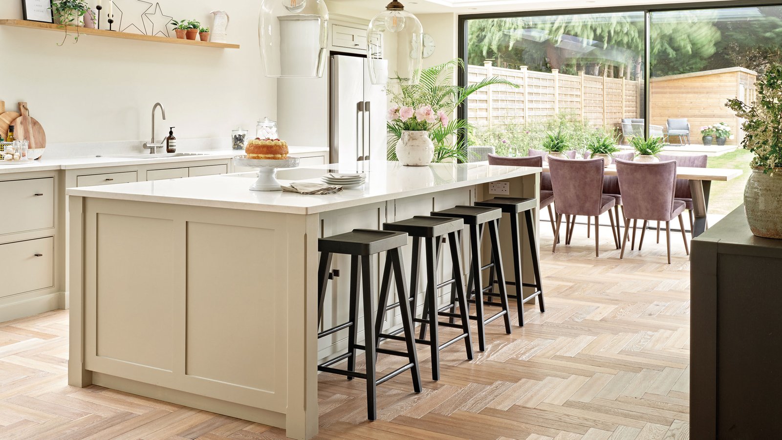 pale herringbone wood flooring in kitchen diner