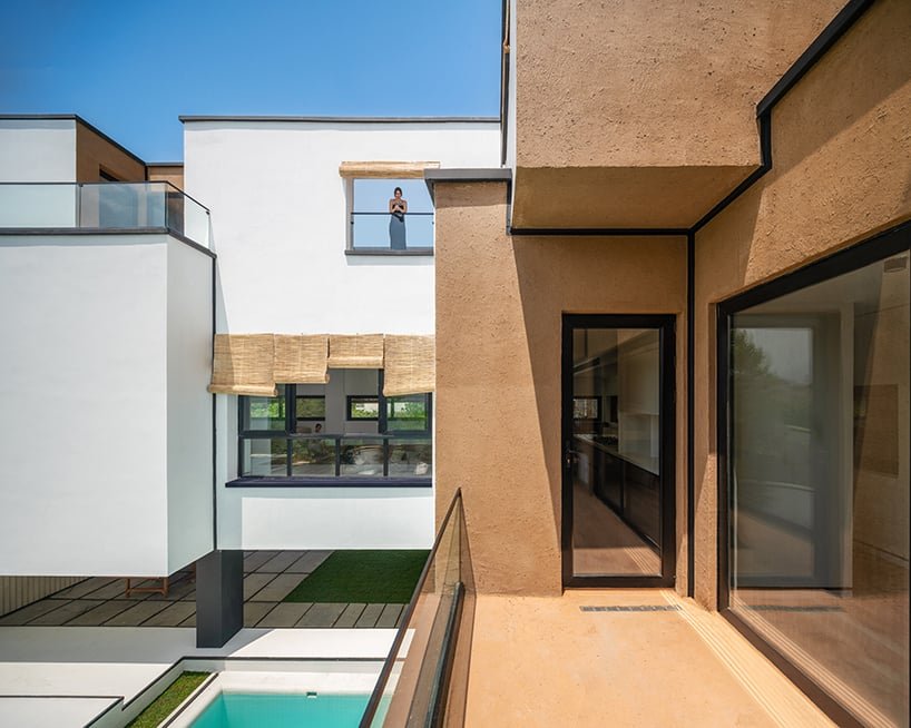 long white curtains cover samon villa's entire open facade in northern iran