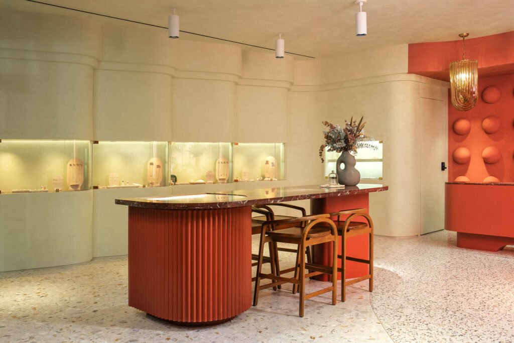 a large marble-topped console with a jewelry display