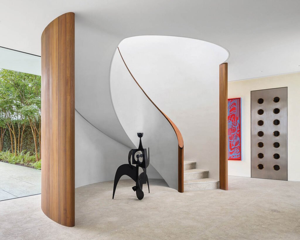 a wrapping staircase inside a beach house