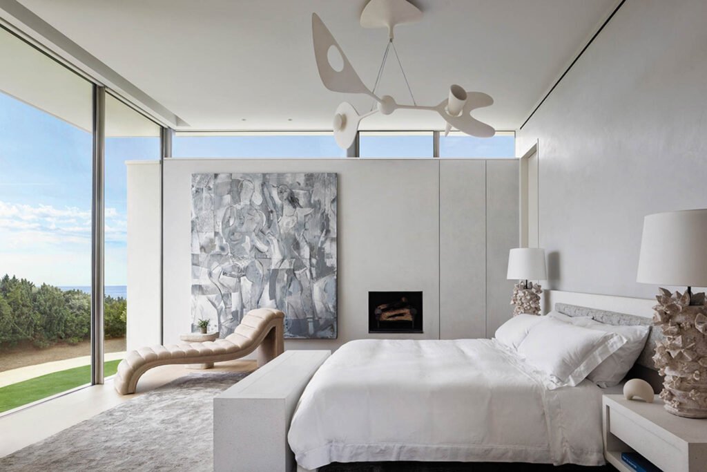 a modern bedroom inside a beach house