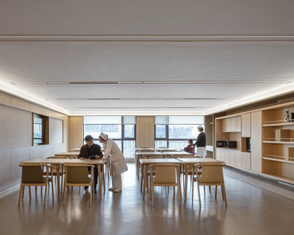 dining area with calm lighting and wooden walls