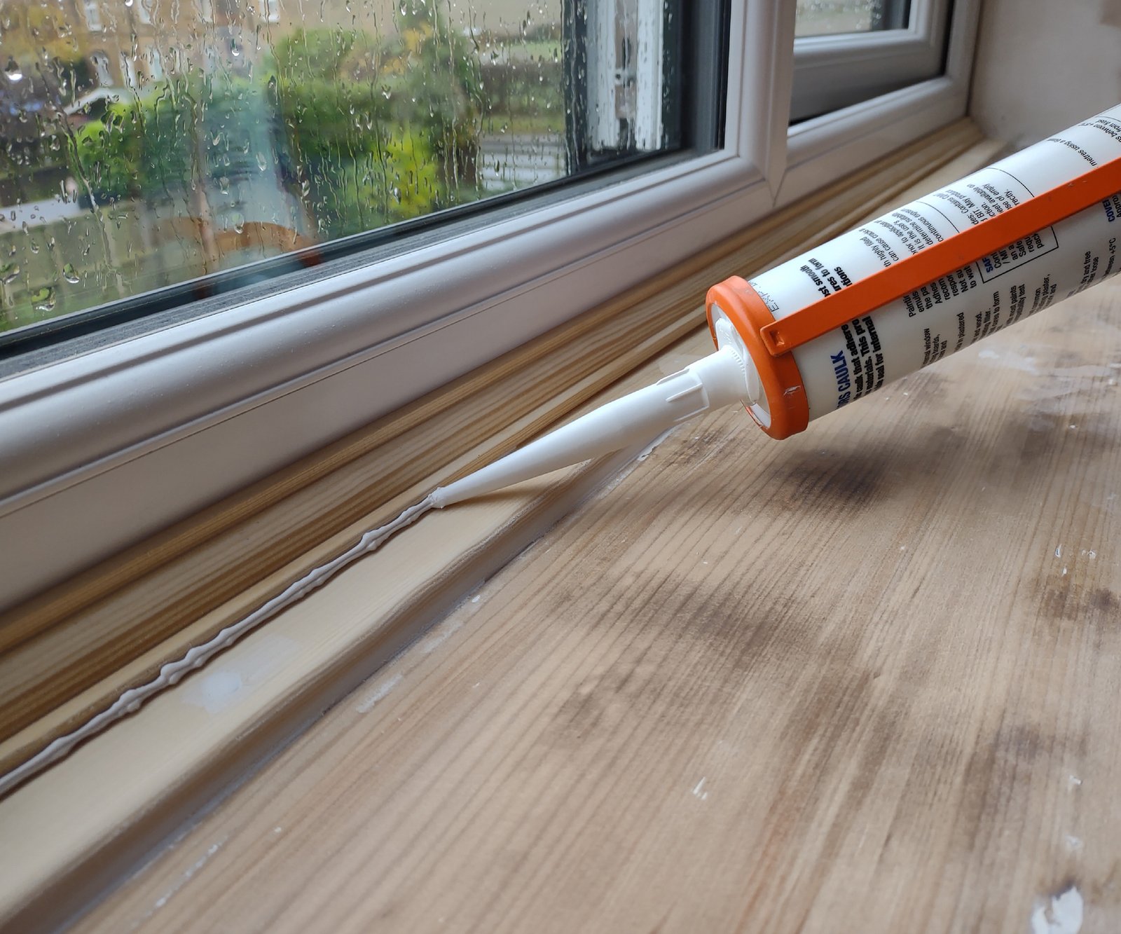 caulking a window sill