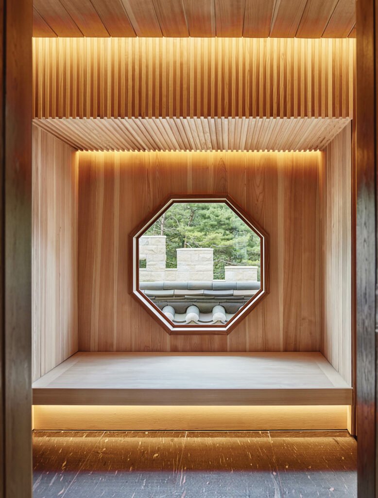 a hexagon-shaped window in a wooden wall