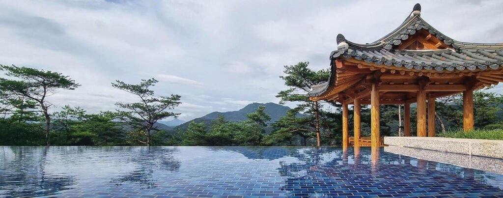 an outdoor infinity pool overlooking mountains