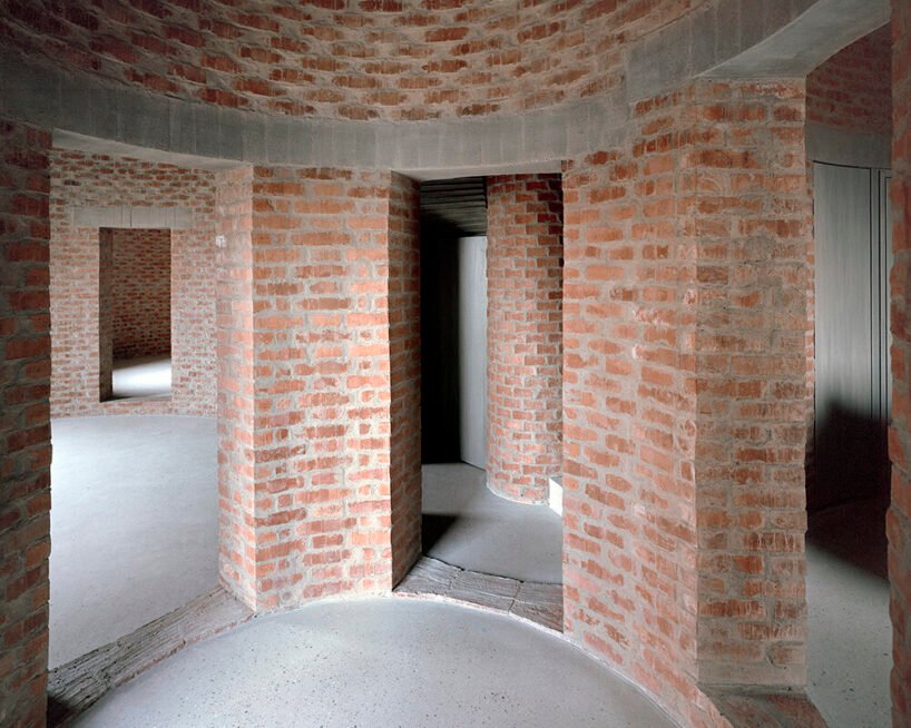 christian kerez's house okamura unfolds as a cluster of circular brick volumes in czechia
