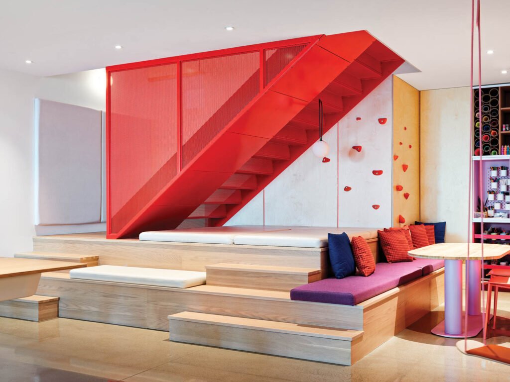 sitting room with red stairs and wooden seating area