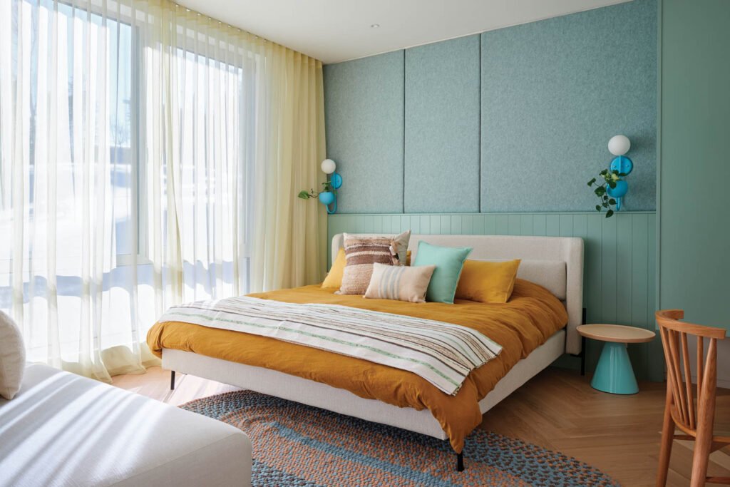 bedroom with teal blue walls and bed