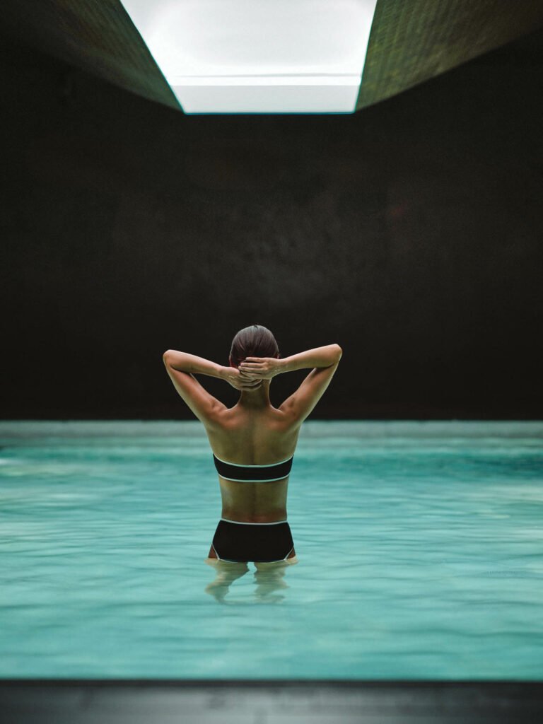 woman standing in the middle of the pool