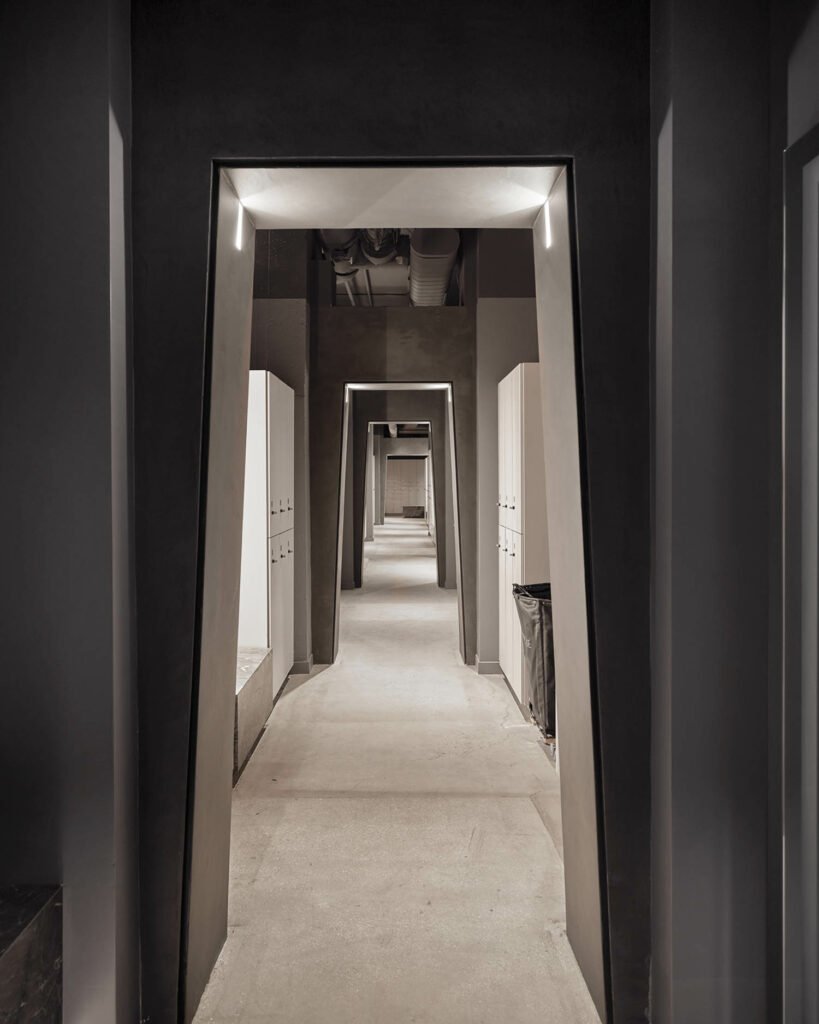 long hallway with dark moody lighting